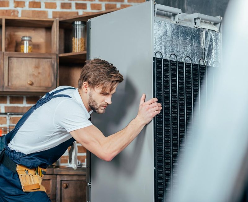 young-repairman-in-protective-workwear-moving-refr-resize.jpg young-repairman-in-protective-workwear-moving-refr-resize.jpg